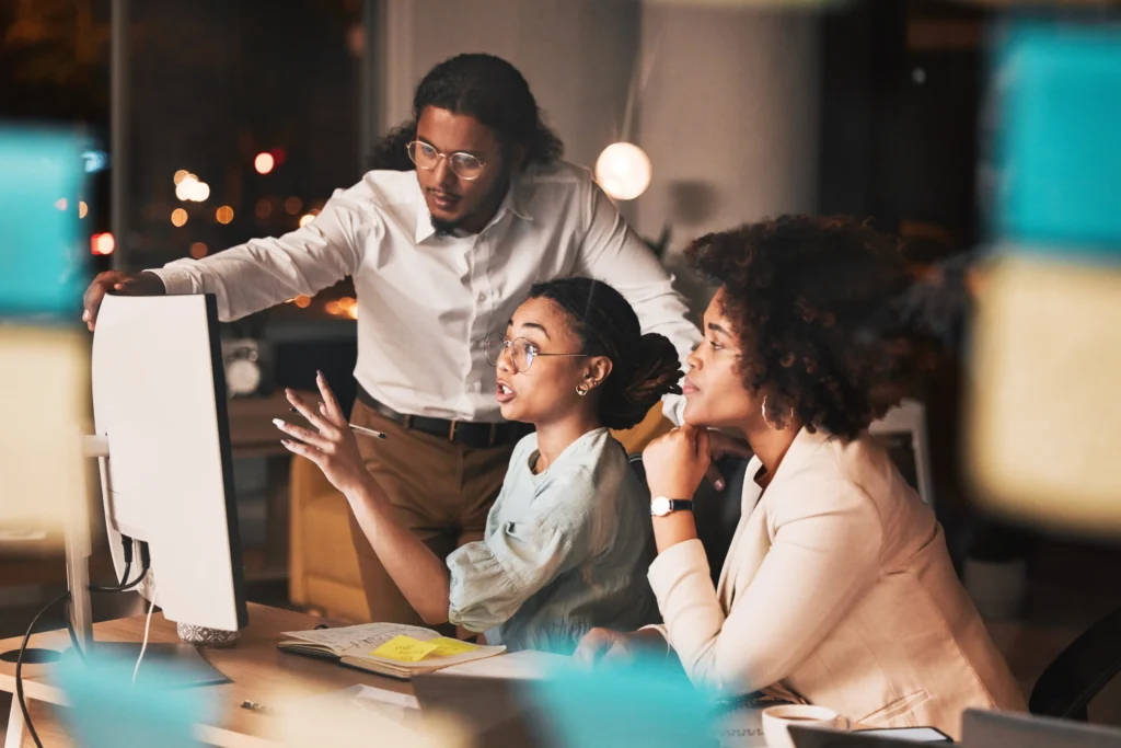 Surrealeffect Digital Marketing Services: a marketing team discusing insights on office